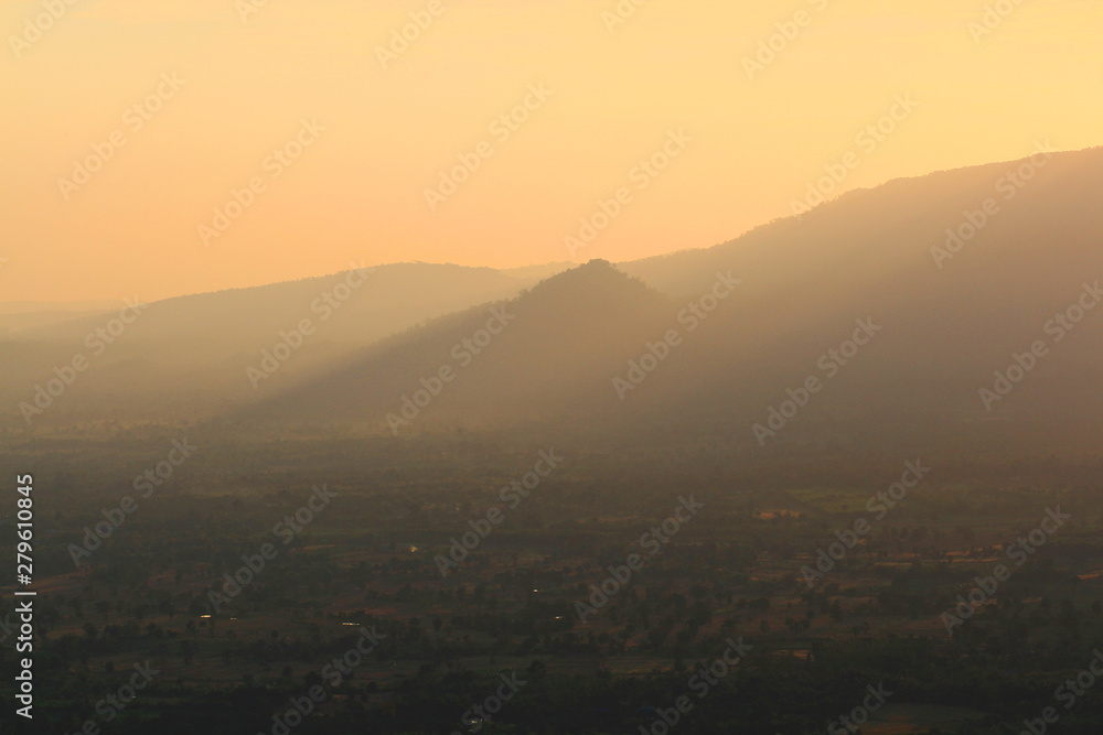 Obraz premium Beautiful landscape layers of mountain and Misty on hill valley in golden twilight of sunset at Thailand