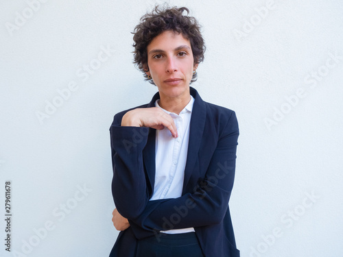 Photos Portrait of serious confident androgynous businesswoman