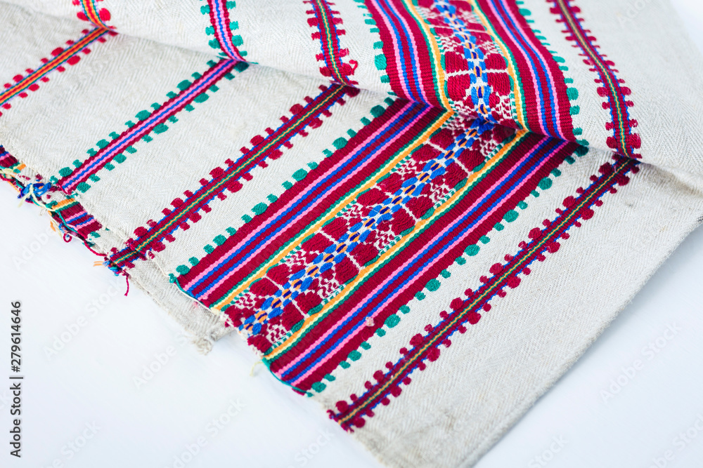 A stack of woven linen towels with embroidery, traditional handmade in Ukraine. A stack of woven linen towels with embroidery, traditional handmade in Ukraine.