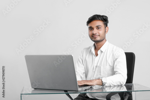 young indian man working at office