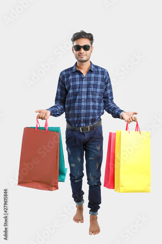 young indian man with shopping bags, Indian festival