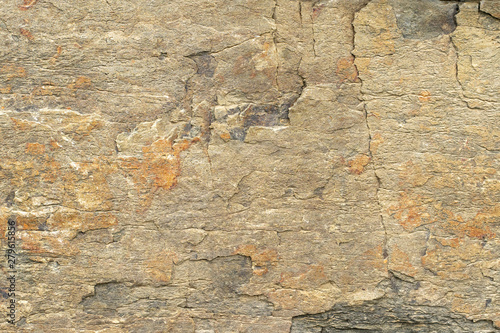 Natural background. Texture of beige sandstone with corrosion pattern