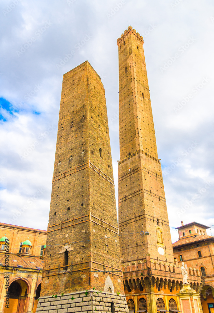 Two medieval towers of Bologna (Le Due Torri): Asinelli tower and Garisenda tower on Piazza di Porta Ravegnana square in old historical city centre, famous landmarks, Emilia-Romagna, Italy