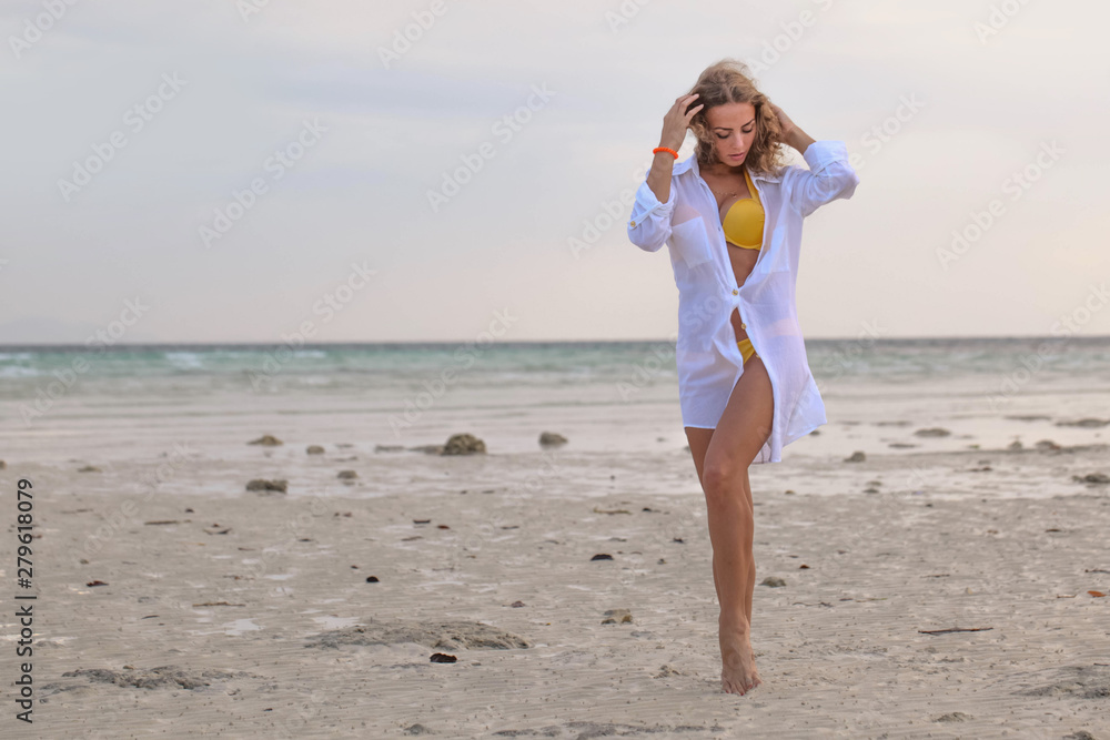 Woman in bikini at tropical beach