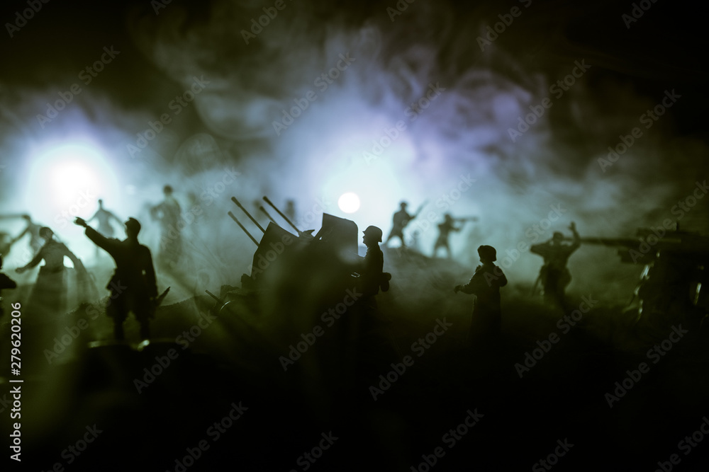 Fototapeta premium War Concept. Military silhouettes fighting scene on war fog sky background,