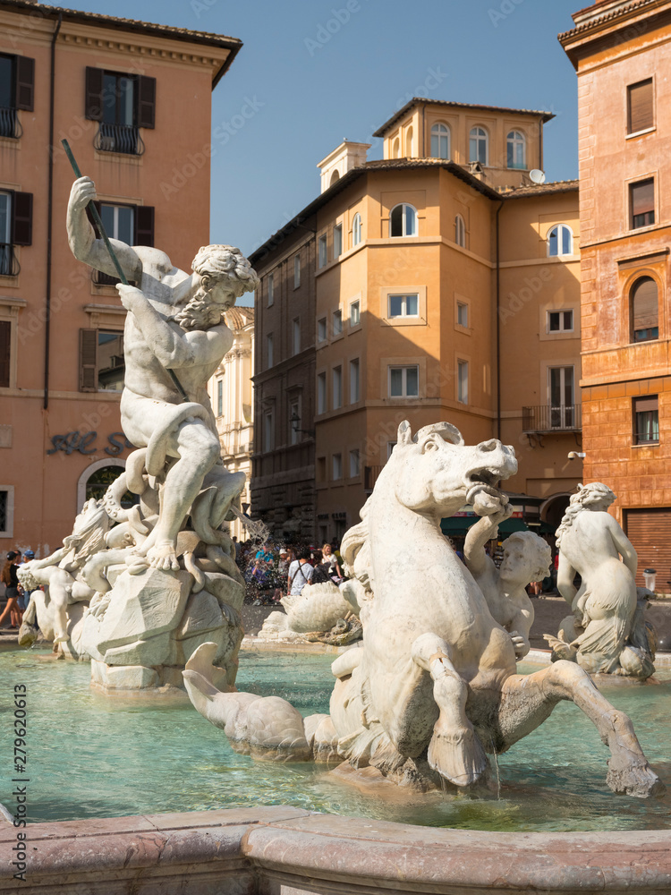 fountain on square Navona in Italy with sculptures of horse and Neptune