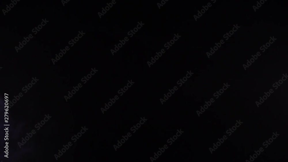 White smoke on black background in slow motion. White smoke on black background in slow motion.