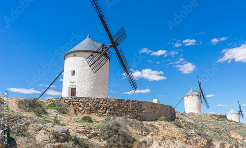 Beautiful summer above the windmills on the field in Spain