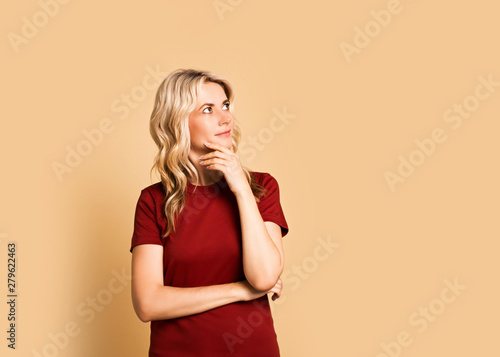 Blonde woman adult attractive beautiful smiling portrait, caucasian girl in t-short on pink background