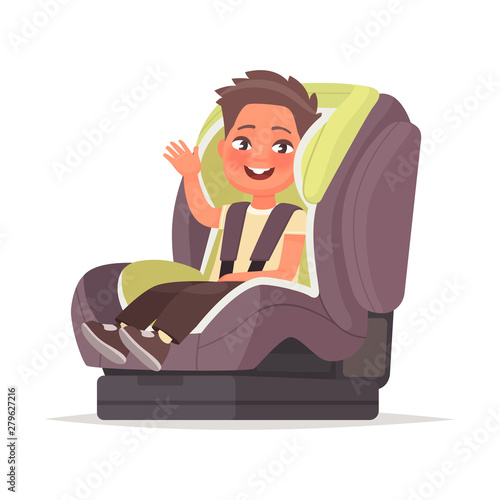 Happy baby sitting in the child car seat. Armchair for the child for safe movement on the vehicle