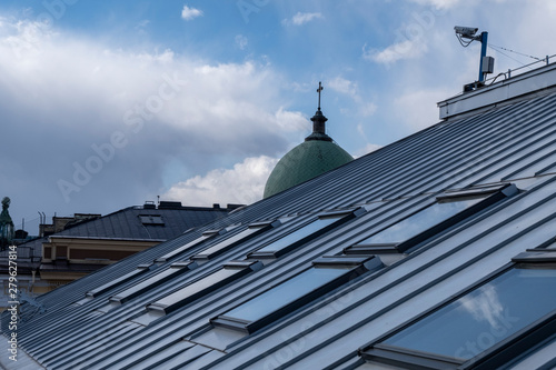 Roof windows and skylights and blue sky