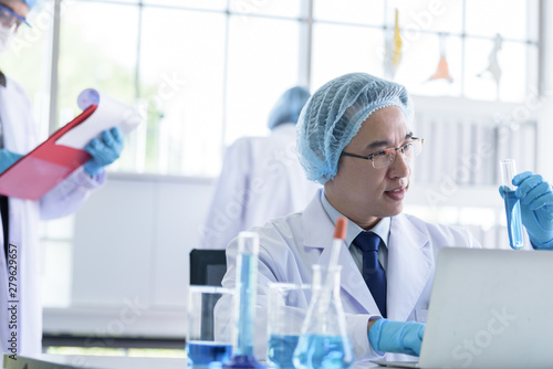 Asian senior scientist male researching and learning in a laboratory.