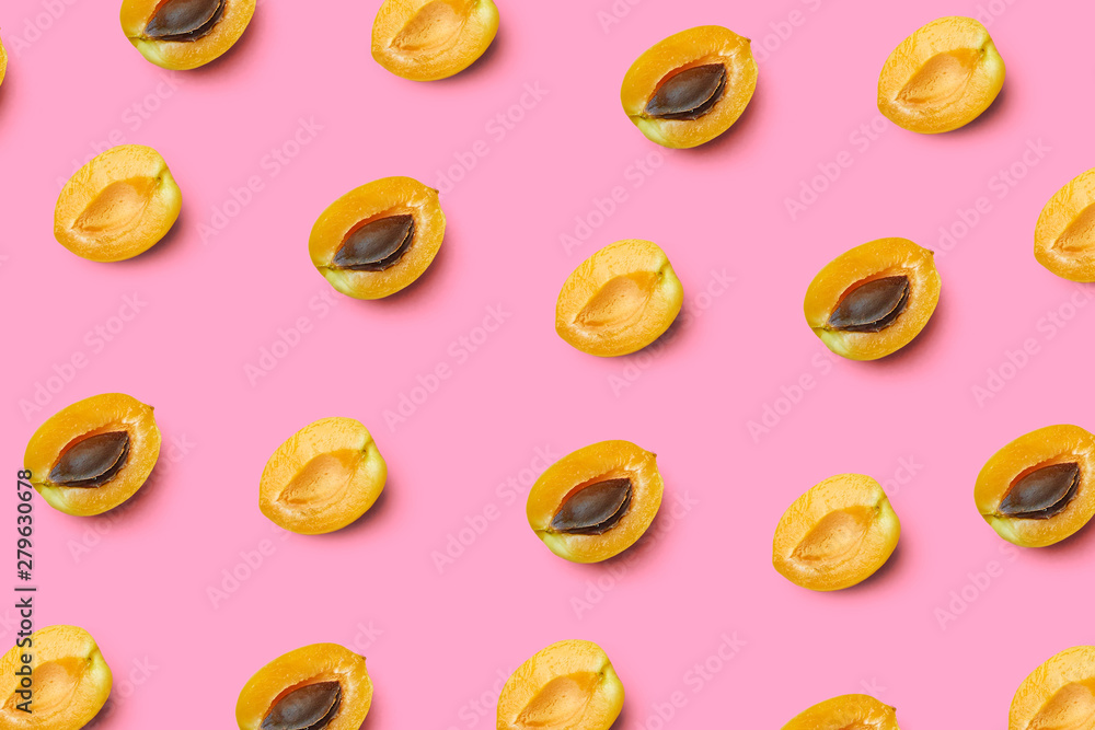 Apricots on a colored background. Pattern of a apricots. Apricots isolated, flat lay, top view Apricots on a colored background. Pattern of a apricots. Apricots isolated, flat lay, top view