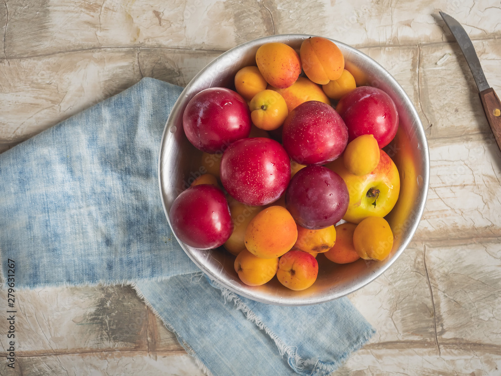 Fresh fruit nectarines, cream and apricots in a round plate Fresh fruit nectarines, cream and apricots in a round plate