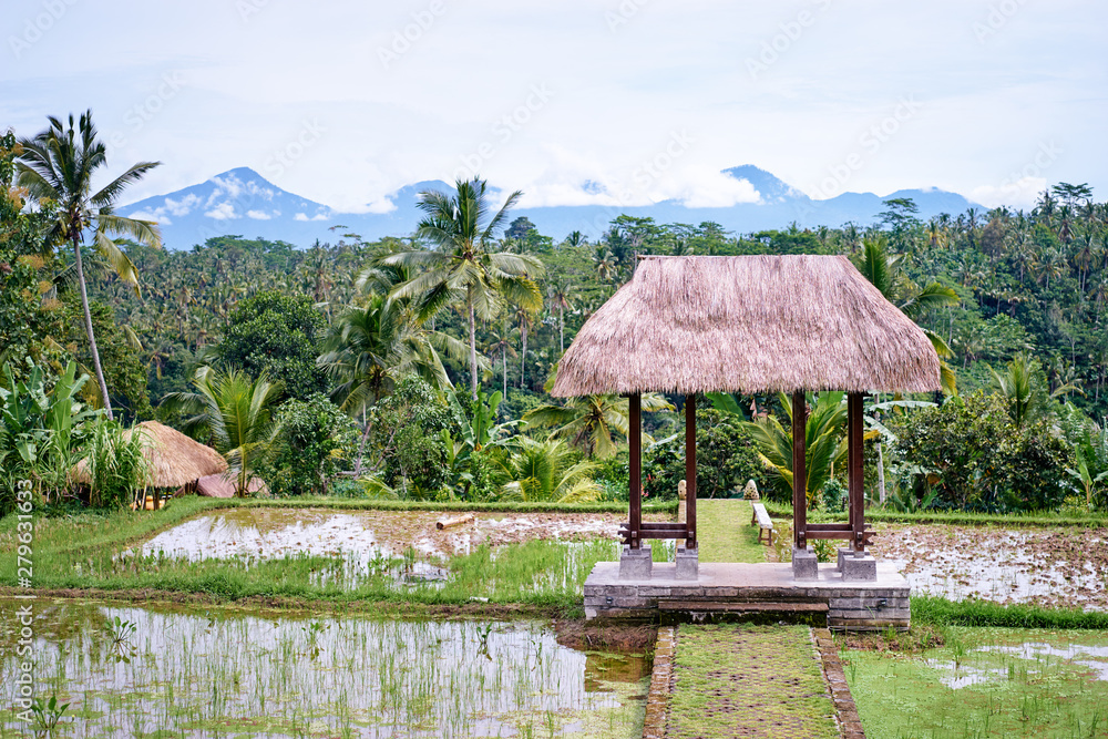 Beautiful green balinese landscape with pavilion on rice field with mountains view. Beautiful green balinese landscape with pavilion on rice field with mountains view.