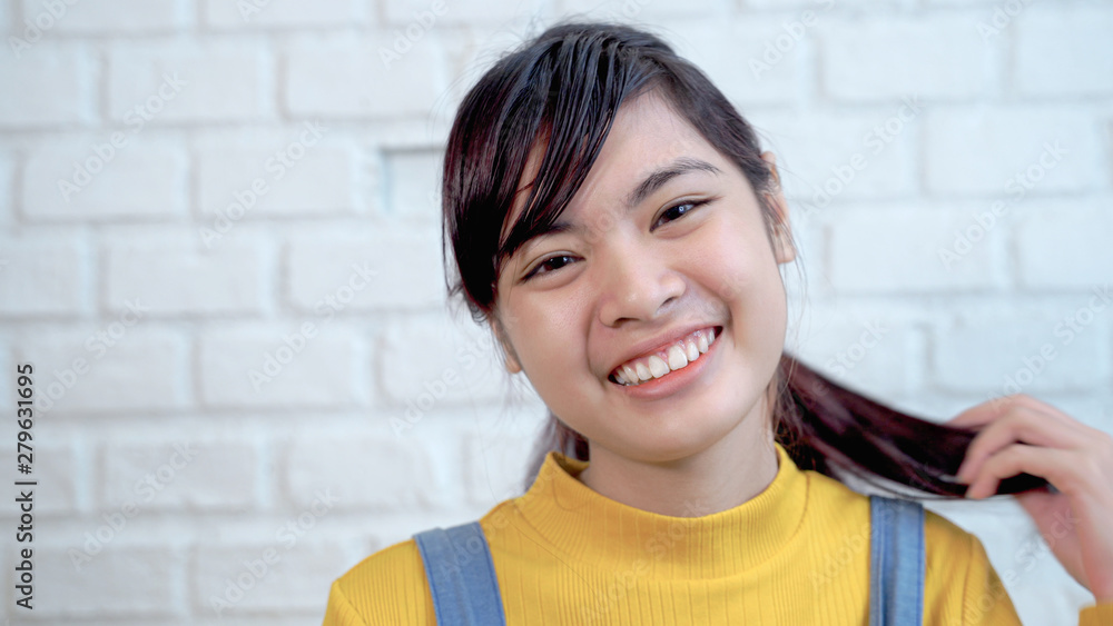 Close up of cute Southeast Asian teenagers are smiling bright and cute Close up of cute Southeast Asian teenagers are smiling bright and cute