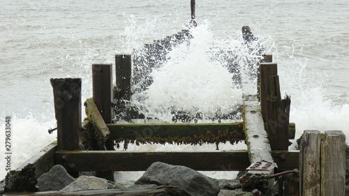 Waves Crashing through an Old Pier