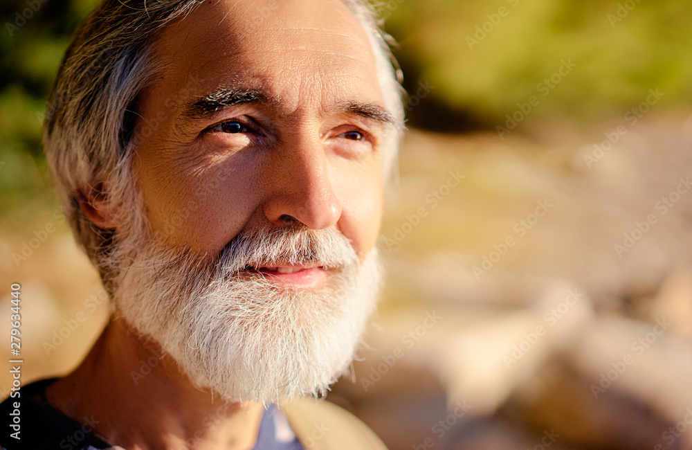 Outdoor Portrait Of Stylish Old Smiling Man With Long Grey Hipster Beard  by Stocksy Contributor VISUALSPECTRUM - Stocksy