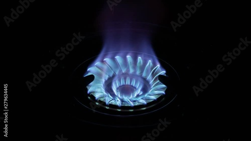Blue flame from gas stove in the dark