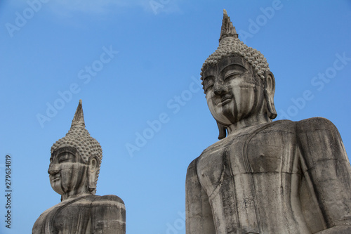 Buddha face in blue sky background  Buddha statue in Thailand.