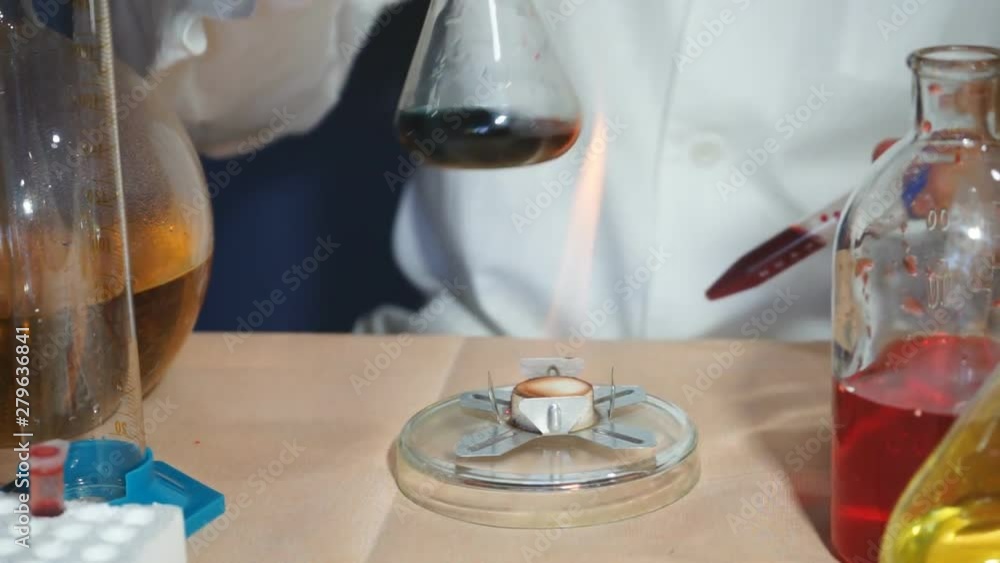 Laboratory scientist working at lab with test tubes. Laboratory scientist working at lab with test tubes.