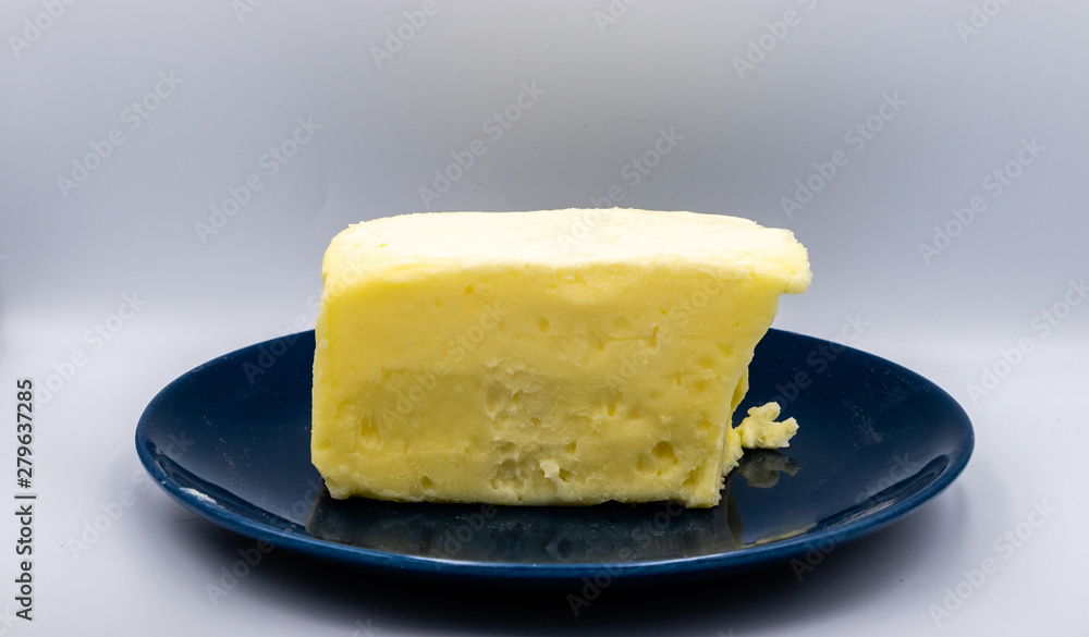 Butter on a blue plate against colourful back drop. Calgary, Alberta, Canada Butter on a blue plate against colourful back drop. Calgary, Alberta, Canada
