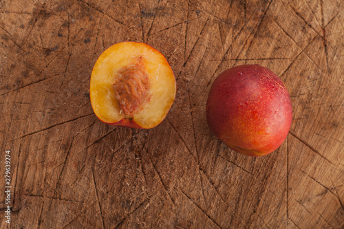 ripe sweet nectarine on a wooden background