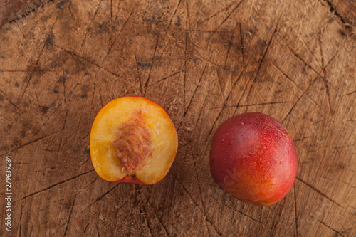 ripe sweet nectarine on a wooden background