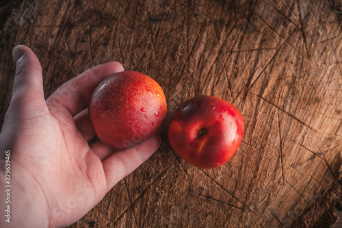 ripe sweet nectarine on a wooden background