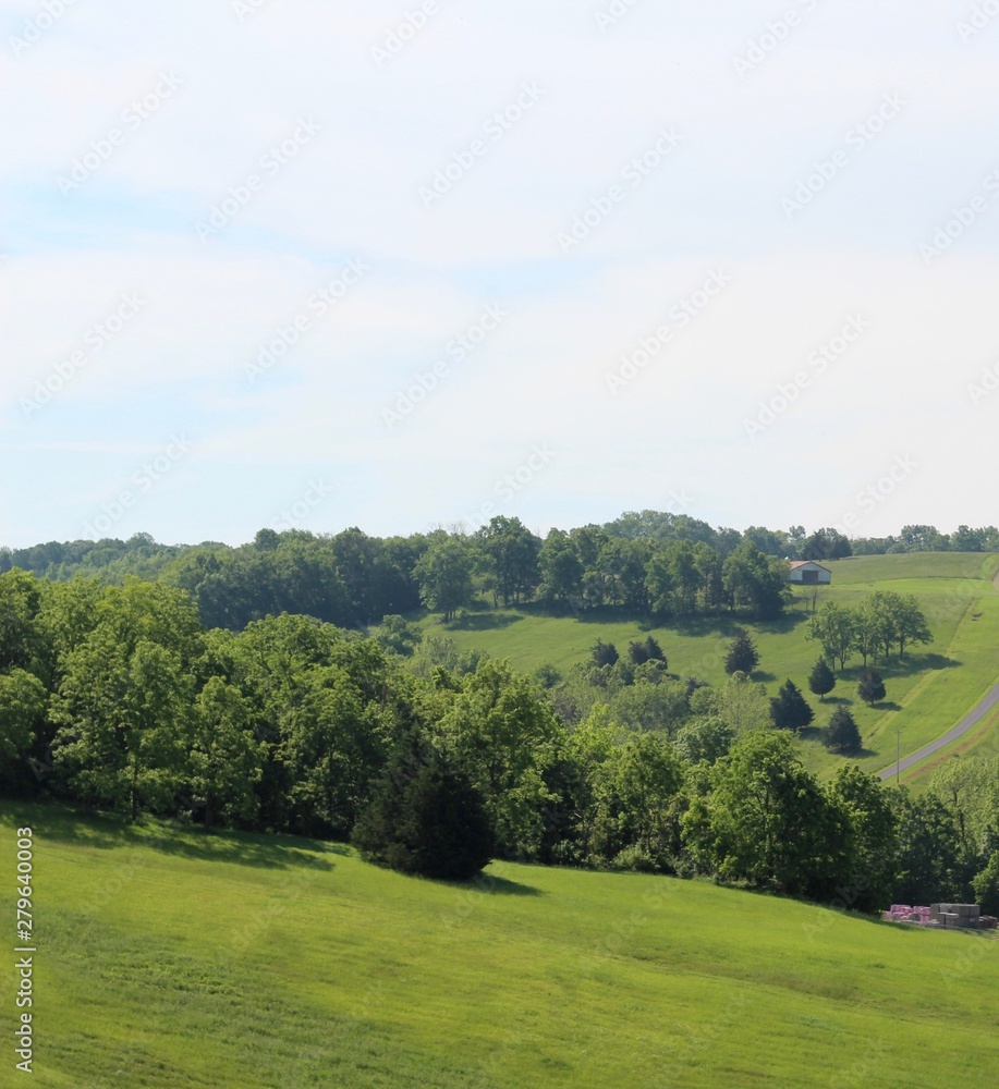 The rolling countryside hills on a sunny springtime day. The rolling countryside hills on a sunny springtime day.