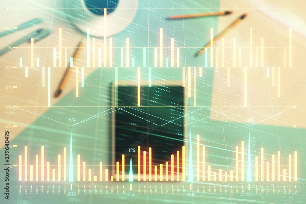 Double exposure of forex graph on digital tablet laying on table background. Concept of market analysis Double exposure of forex graph on digital tablet laying on table background. Concept of market analysis