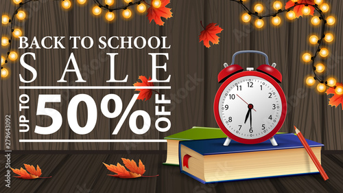 Back to school sale, discount web banner with wooden texture, school books and alarm clock