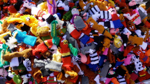 Many small self-made colorful finger puppets for sale at a flea market 