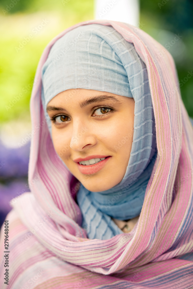 Young attractive Arabian female with natural makeup in hijab Young attractive Arabian female with natural makeup in hijab