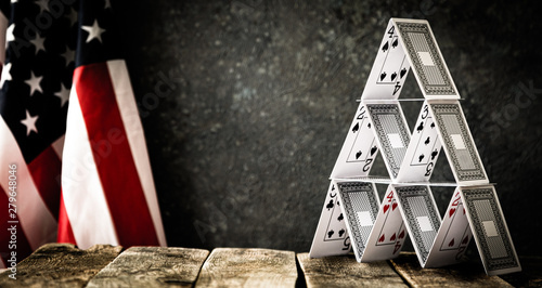 Photography USA political concept - house of cards on rustica background, flag, copy space