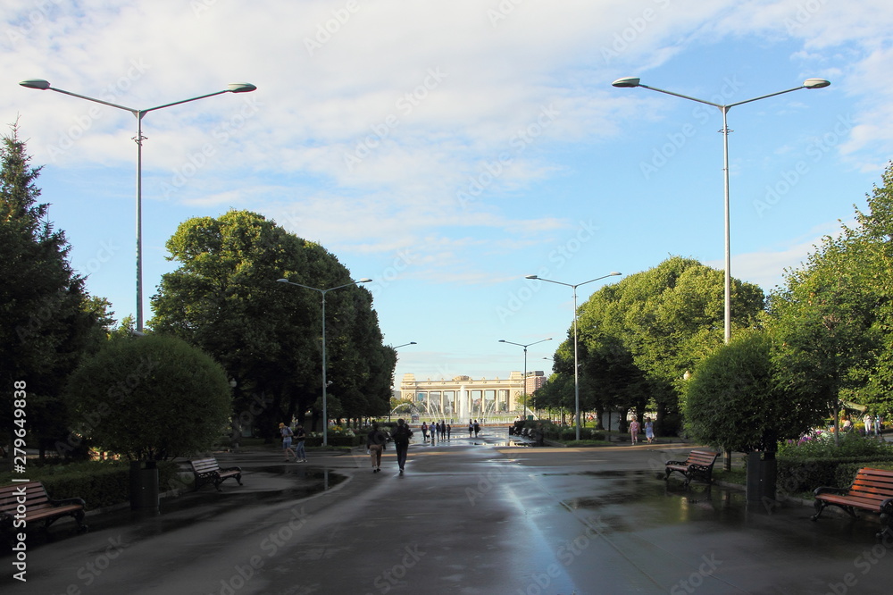 Gorky Park Moscow, view of the alley with street lights and the main entrance on a Sunny summer day after the rain