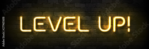 Vector realistic isolated neon sign of Level Up typography logo for template decoration and covering on the wall background. Concept of game.