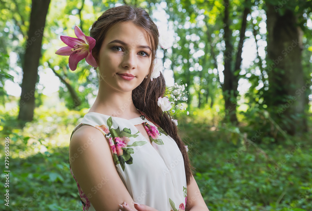 beautiful girl with lilies in her hair, flowers in the luxurious dark hair of a young lady beautiful girl with lilies in her hair, flowers in the luxurious dark hair of a young lady