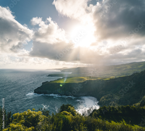 Epic scenic outlook of Miradouro de Santa Iria - north coast of Sao Miguel, largest island of Azores archipelago during sunset with dramatic sky and clouds. © Mathias