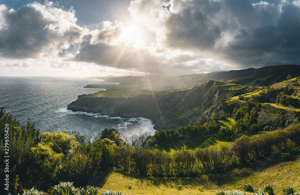 Epic scenic outlook of Miradouro de Santa Iria - north coast of Sao Miguel, largest island of Azores archipelago during sunset with dramatic sky and clouds.