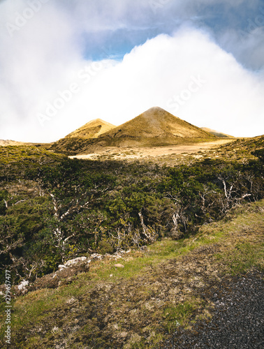 Straight EN3 longitudinal road northeast of Mount Pico and the silhouette of the Mount Pico along   Pico island  Azores  Portugal.