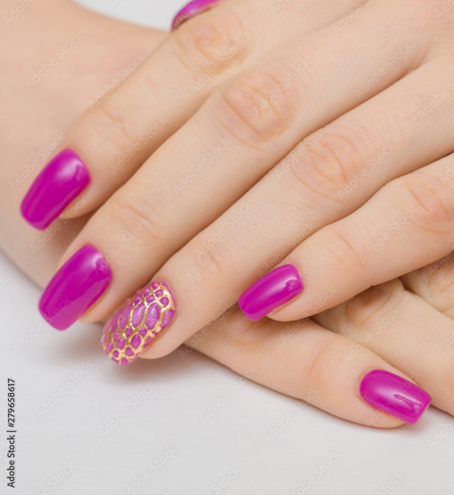 Manicure withpink nail Polish on women's hand. Manicure withpink nail Polish on women's hand.