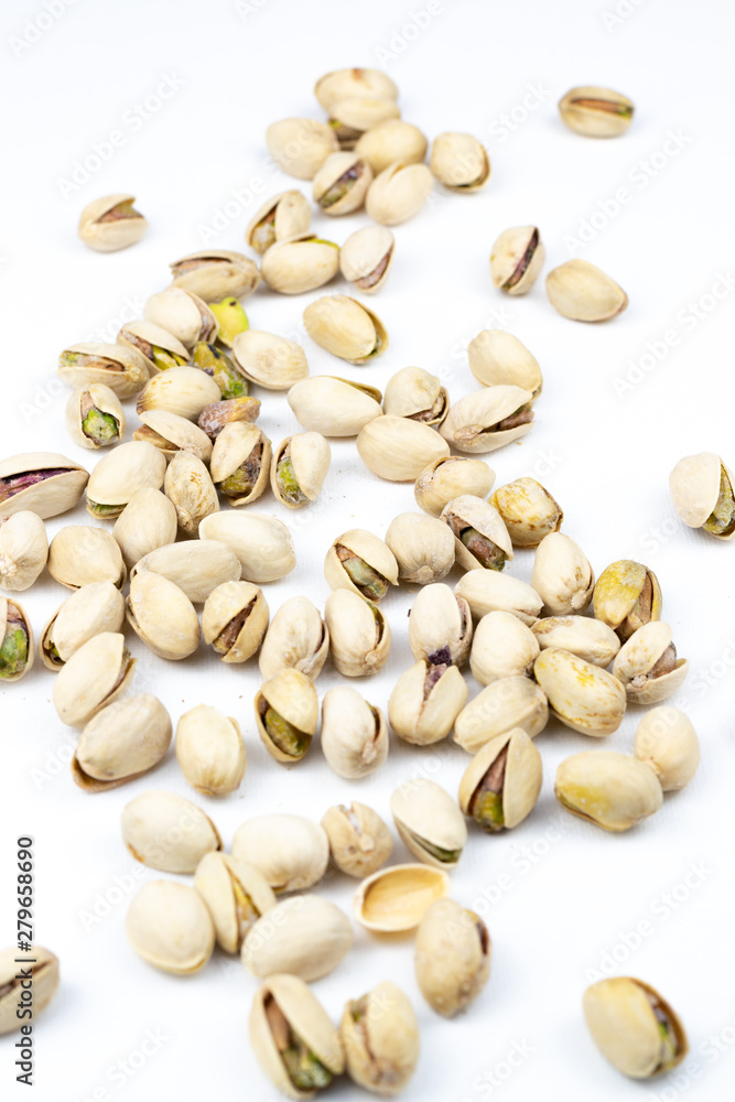  Pistachio nuts isolated on a white background.