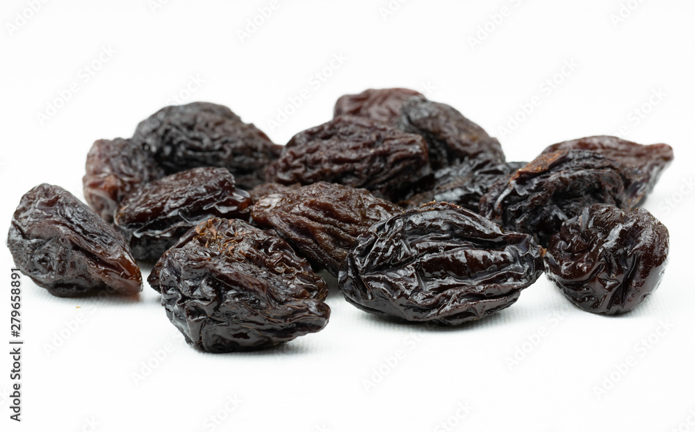 Dried plums isolated on a white background. Dried plums isolated on a white background.