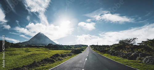 Bilde på lerret Straight EN3 longitudinal road northeast of Mount Pico and the silhouette of the Mount Pico along , Pico island, Azores, Portugal