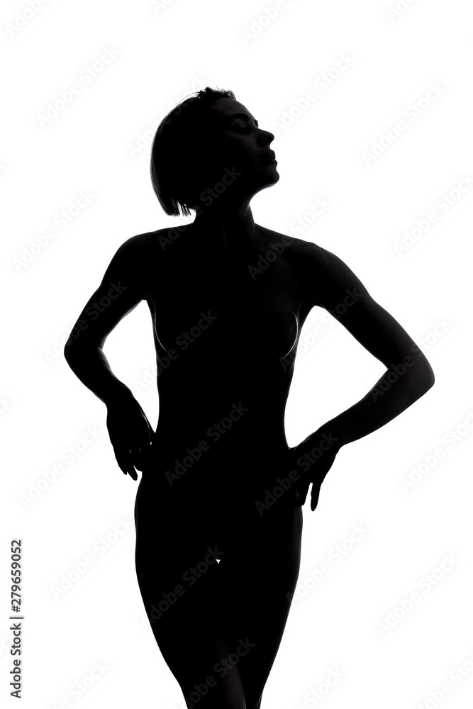 young nude girl with hands on the hips looking up. studio shot.isolated white background, studio shot young nude girl with hands on the hips looking up. studio shot.isolated white background, studio shot