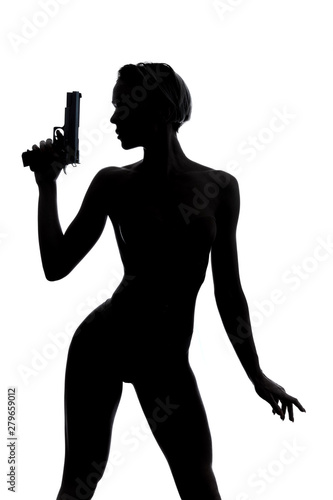 Canvas Print sexy well-builder female murder with raised arm holding a pistol in hand