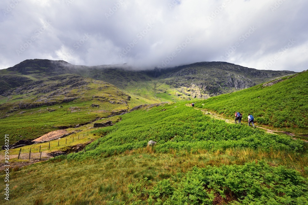 Fototapeta premium Hikers on the path upto Wetherlam