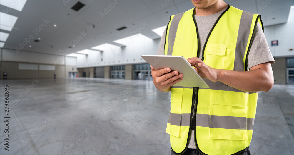 worker hand holding pad for check order pick time in empty warehouse worker hand holding pad for check order pick time in empty warehouse