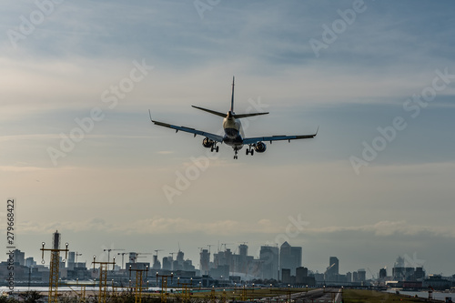 Airline landing at the city airport. Nice summer evening. Travel concept